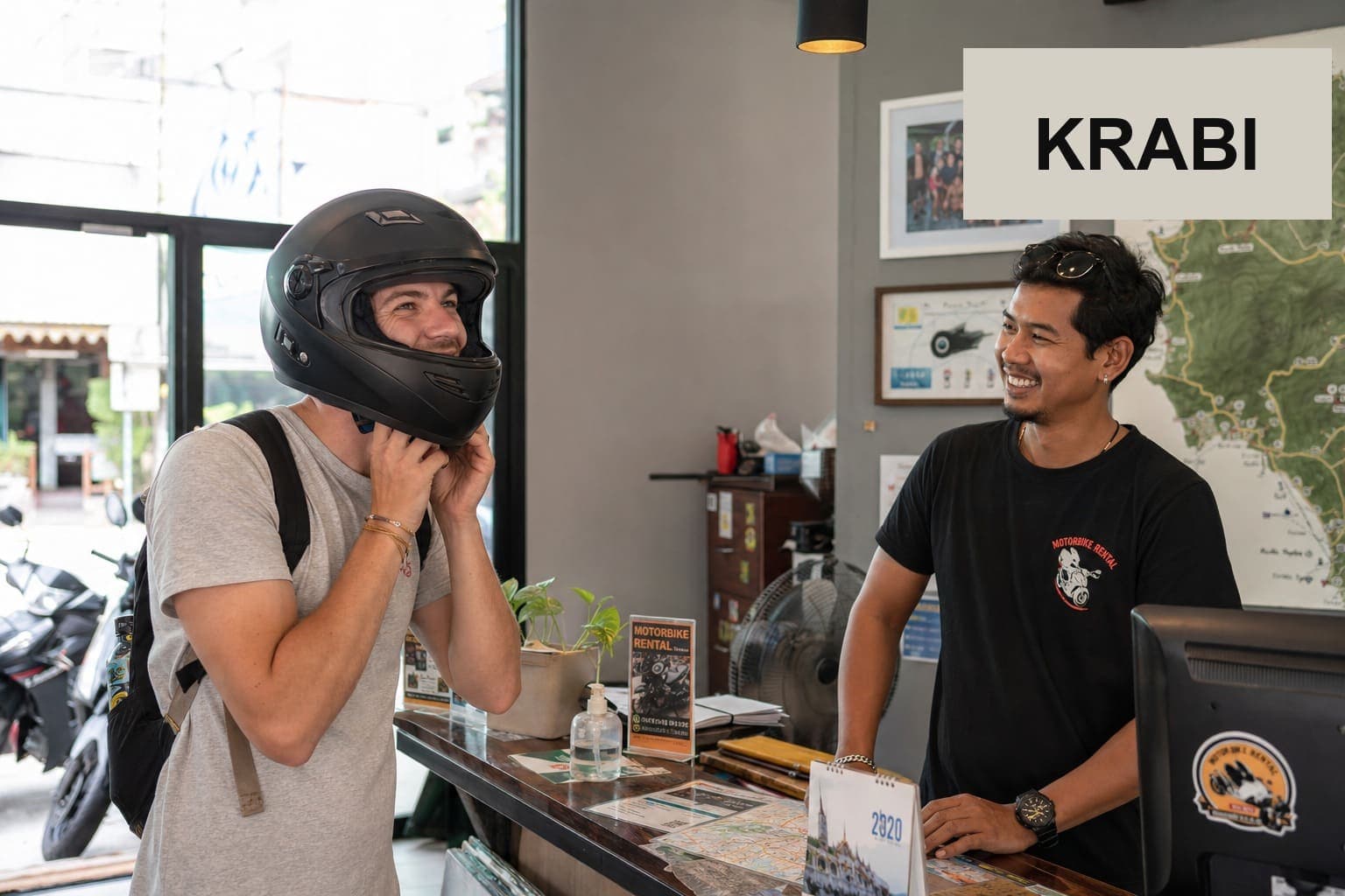 Customer trying on rental riding gear at Krabi Moto Rentals office