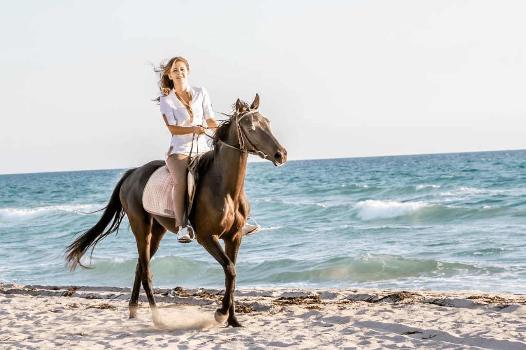 Horseback riding along the shore at Klong Muang Beach, Krabi