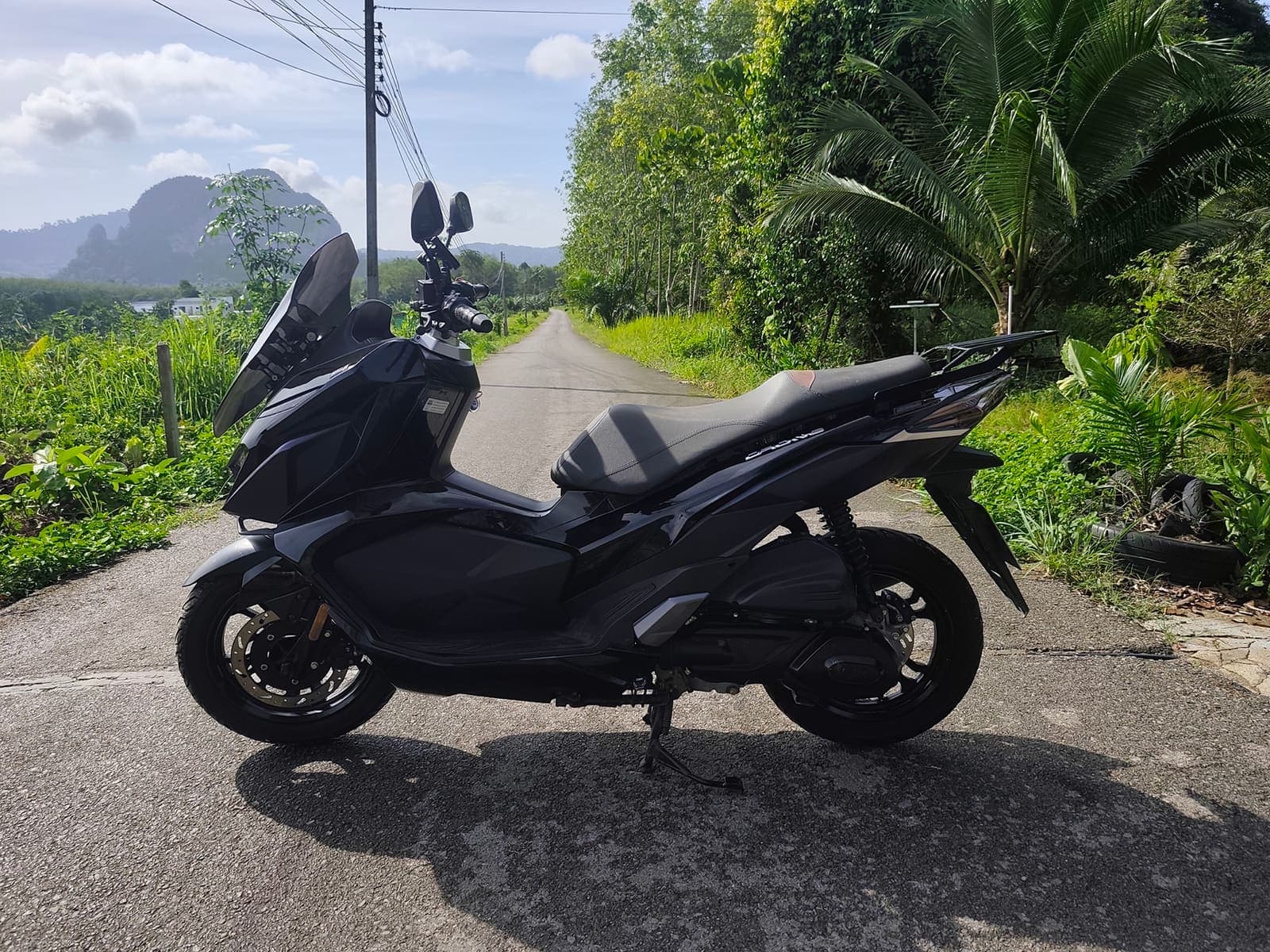 GPX Drone side profile on a scenic Krabi road