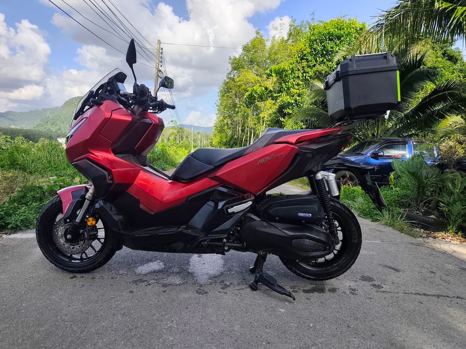Honda ADV350 side profile on a scenic Krabi road
