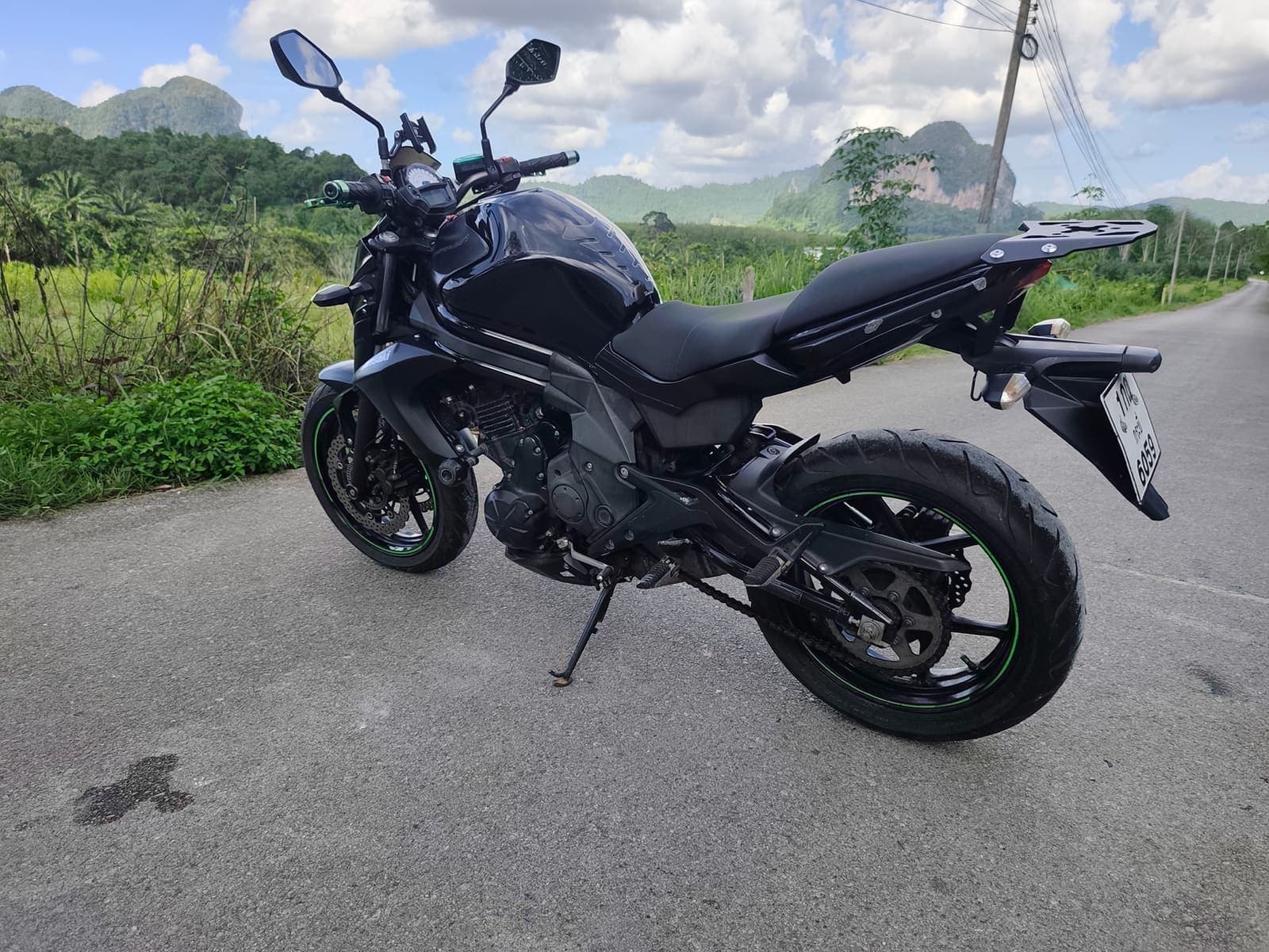 Kawasaki ER-6n side profile on a scenic Krabi road