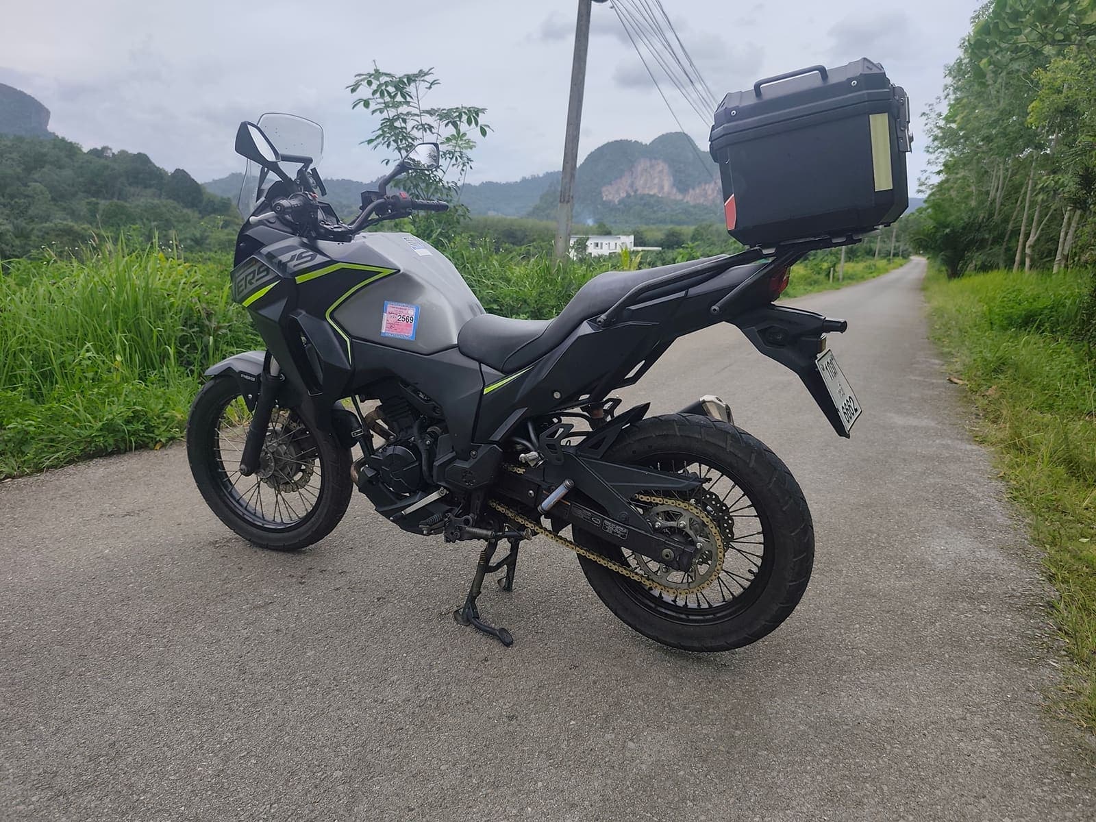 Kawasaki Versys-X 300 side profile on a scenic Krabi road