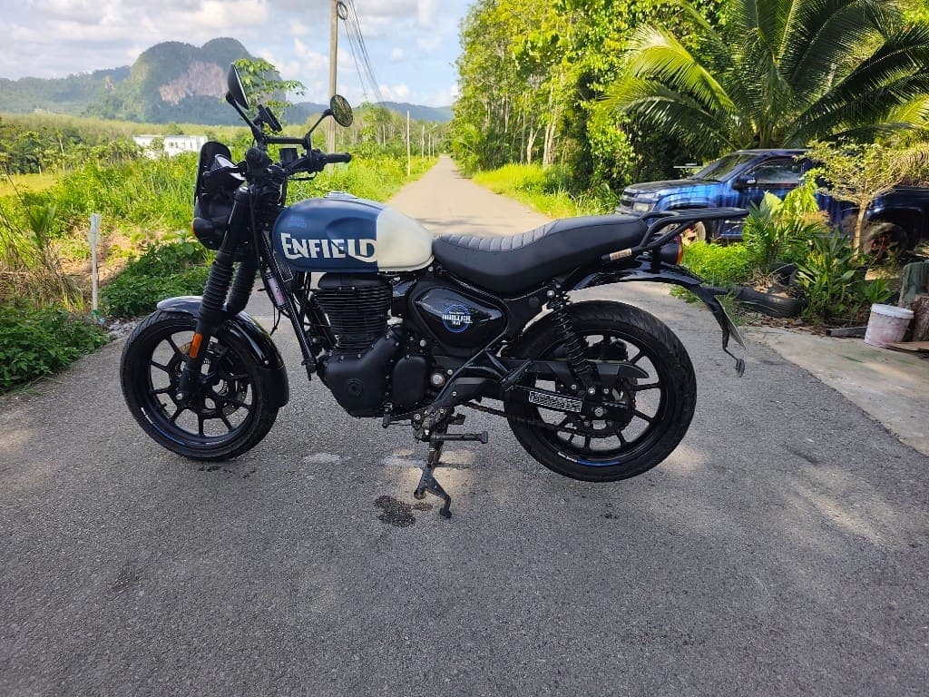 Royal Enfield Hunter 350 side profile on a scenic Krabi road