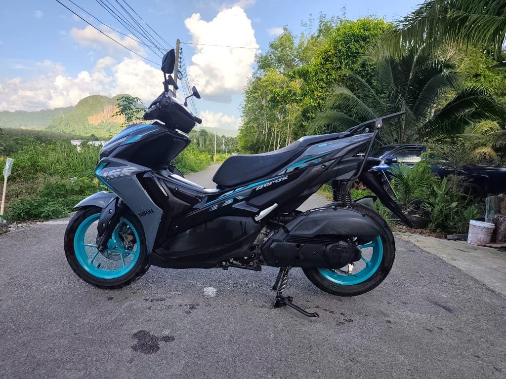 Yamaha Aerox 155 side profile on a scenic Krabi road