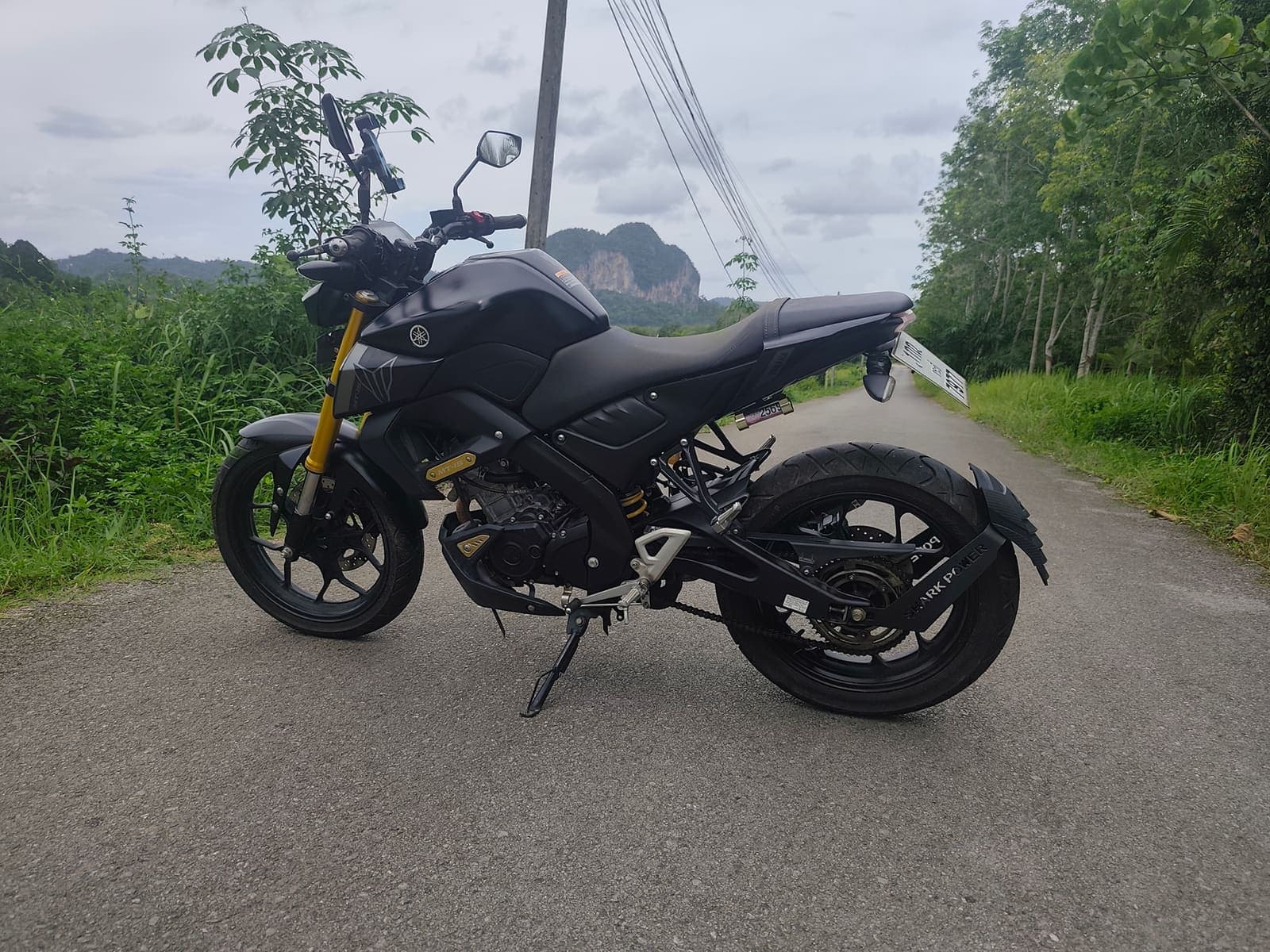 Yamaha MT-15 side profile on a scenic Krabi road