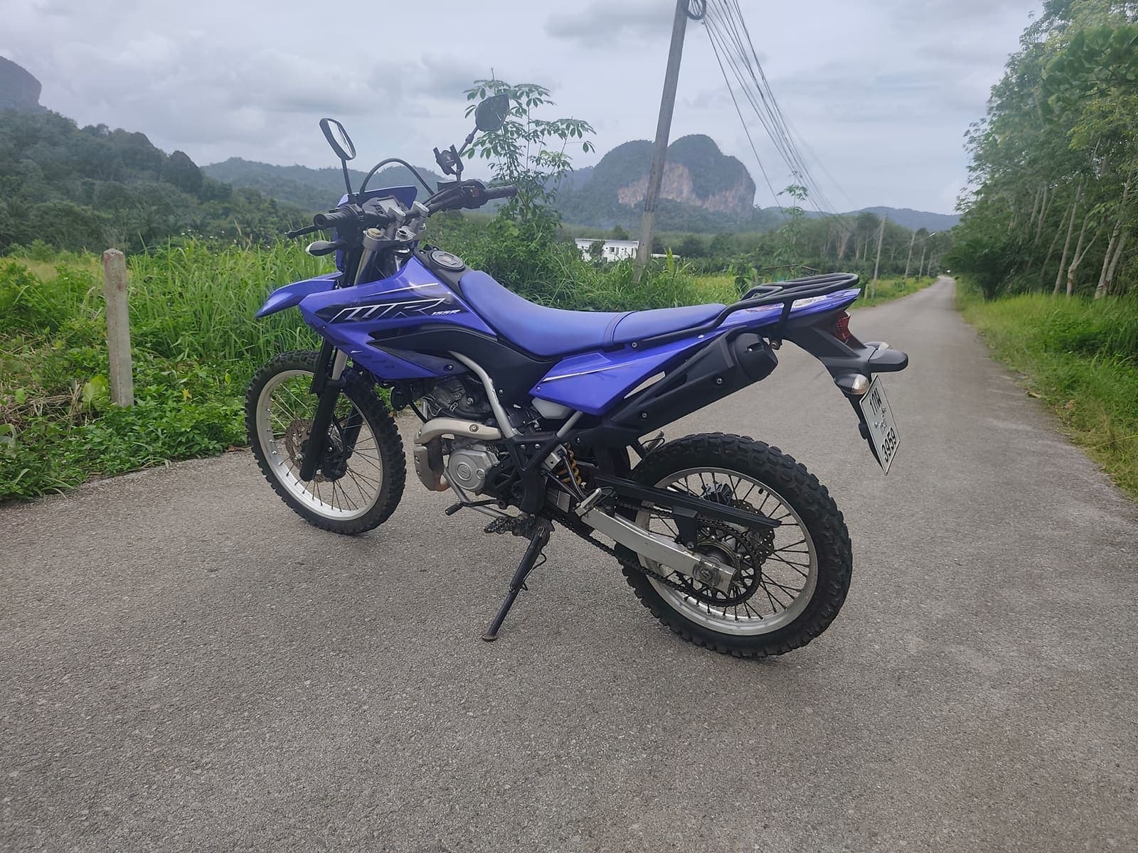 Yamaha WR155R side profile on a scenic Krabi road