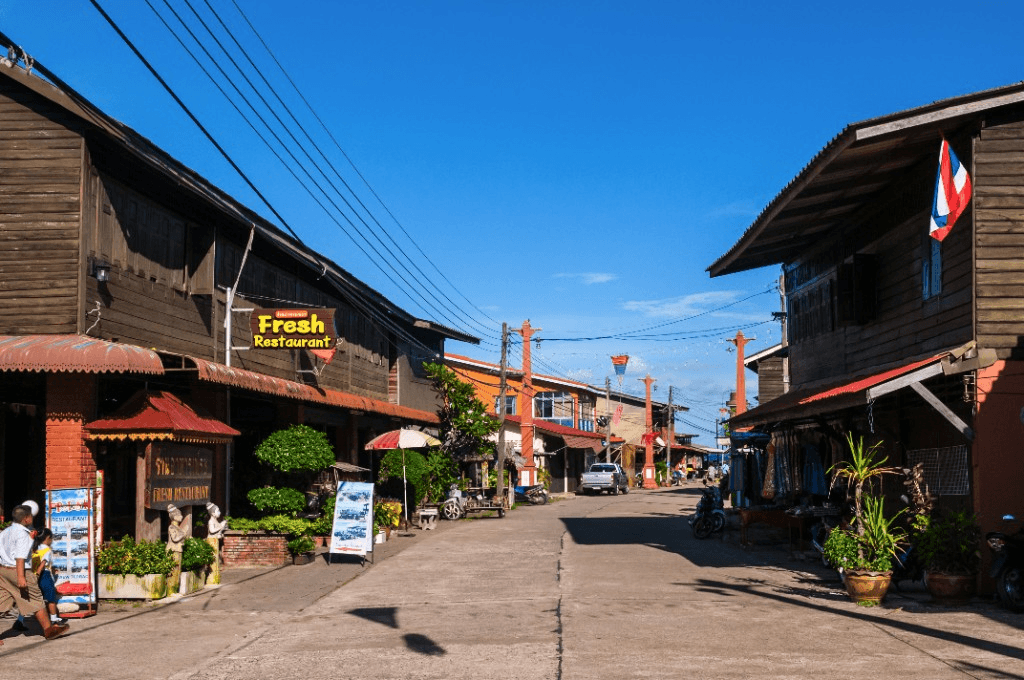 Traditional wooden shop houses and restaurants along Koh Lanta Old Town main street