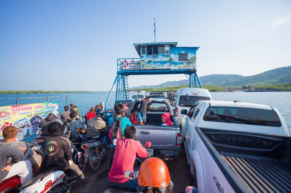 Car ferry crossing to Koh Lanta with motorcycles and vehicles at Saladan