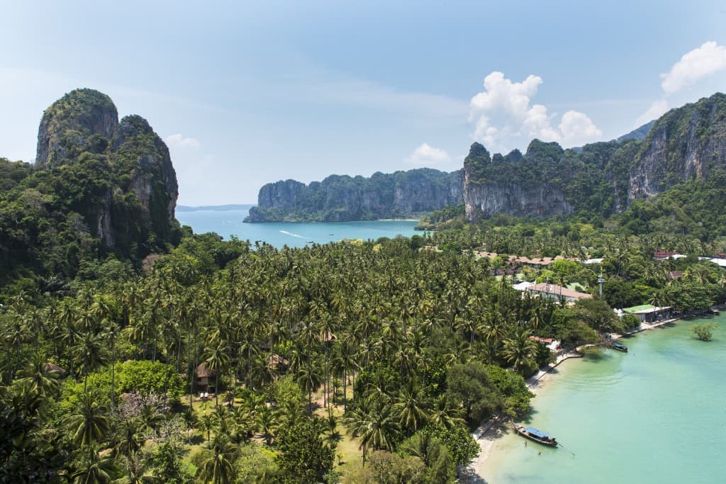 Aerial view of Railay peninsula beaches and limestone cliffs from East Railay viewpoint, Krabi