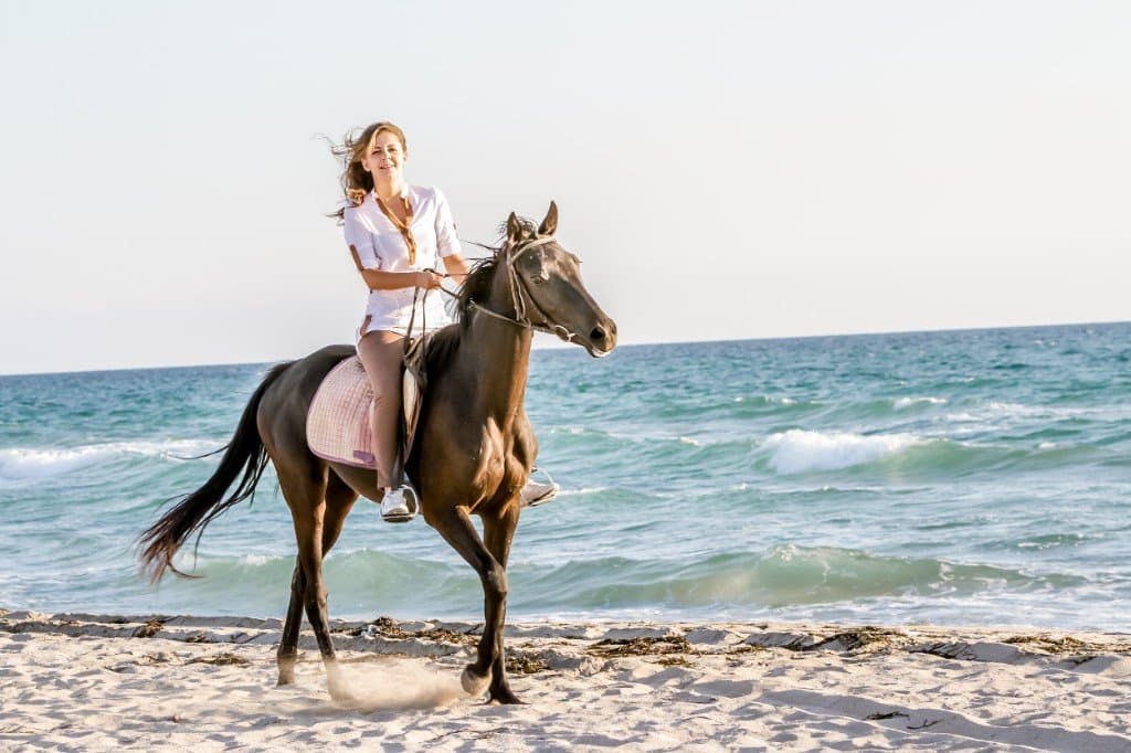 Horseback riding along the shore at Klong Muang Beach, Krabi