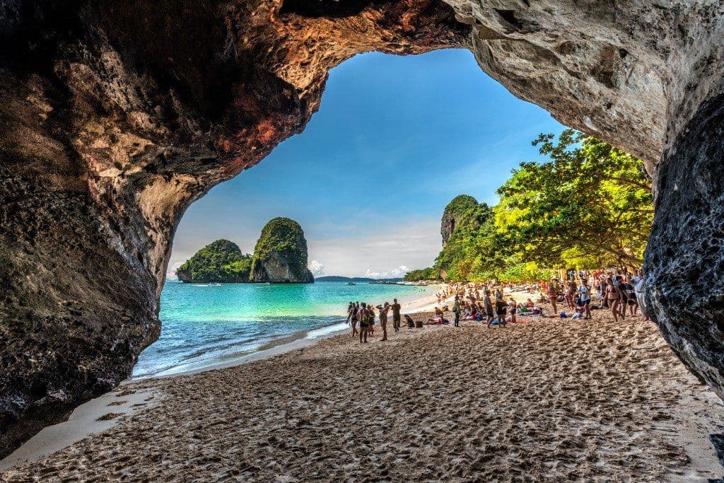 Phra Nang Beach viewed from a limestone cave opening — Railay Peninsula, Krabi