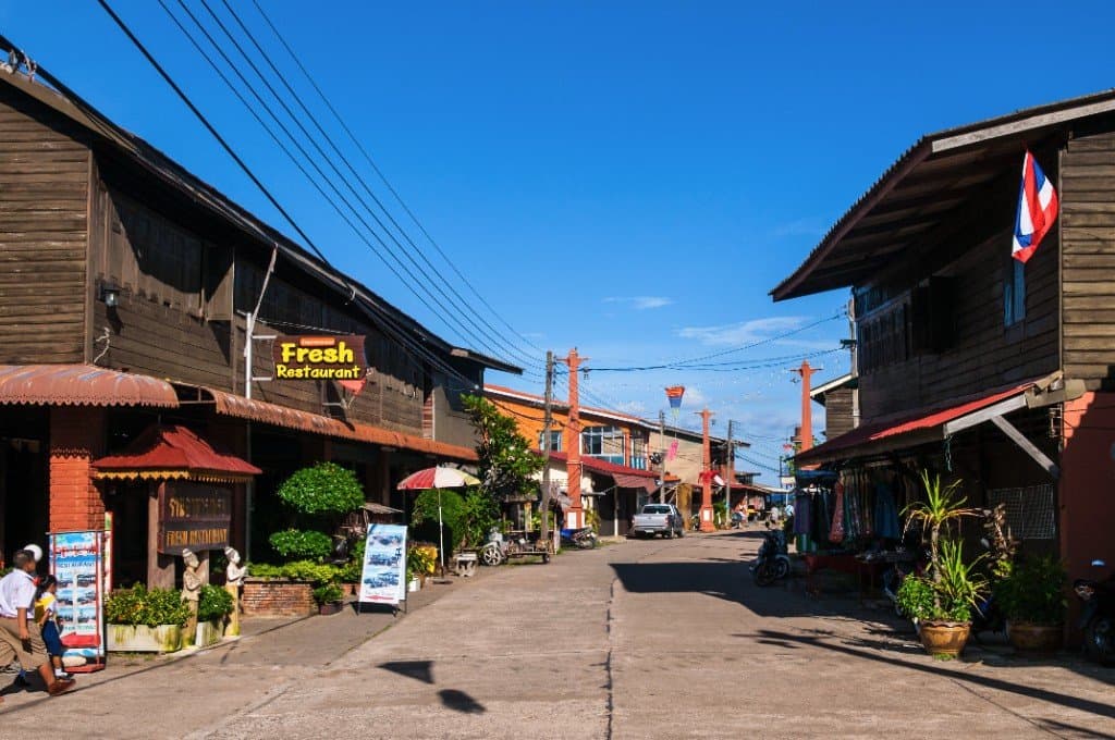Traditional wooden shop houses and restaurants along Koh Lanta Old Town main street