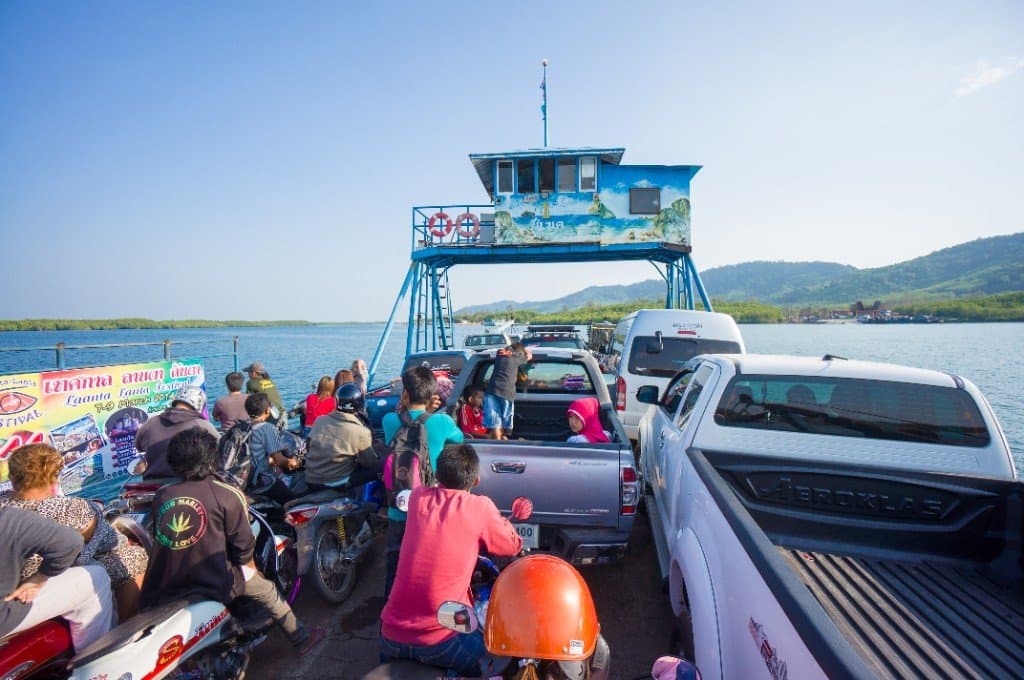 Car ferry crossing to Koh Lanta with motorcycles and vehicles at Saladan