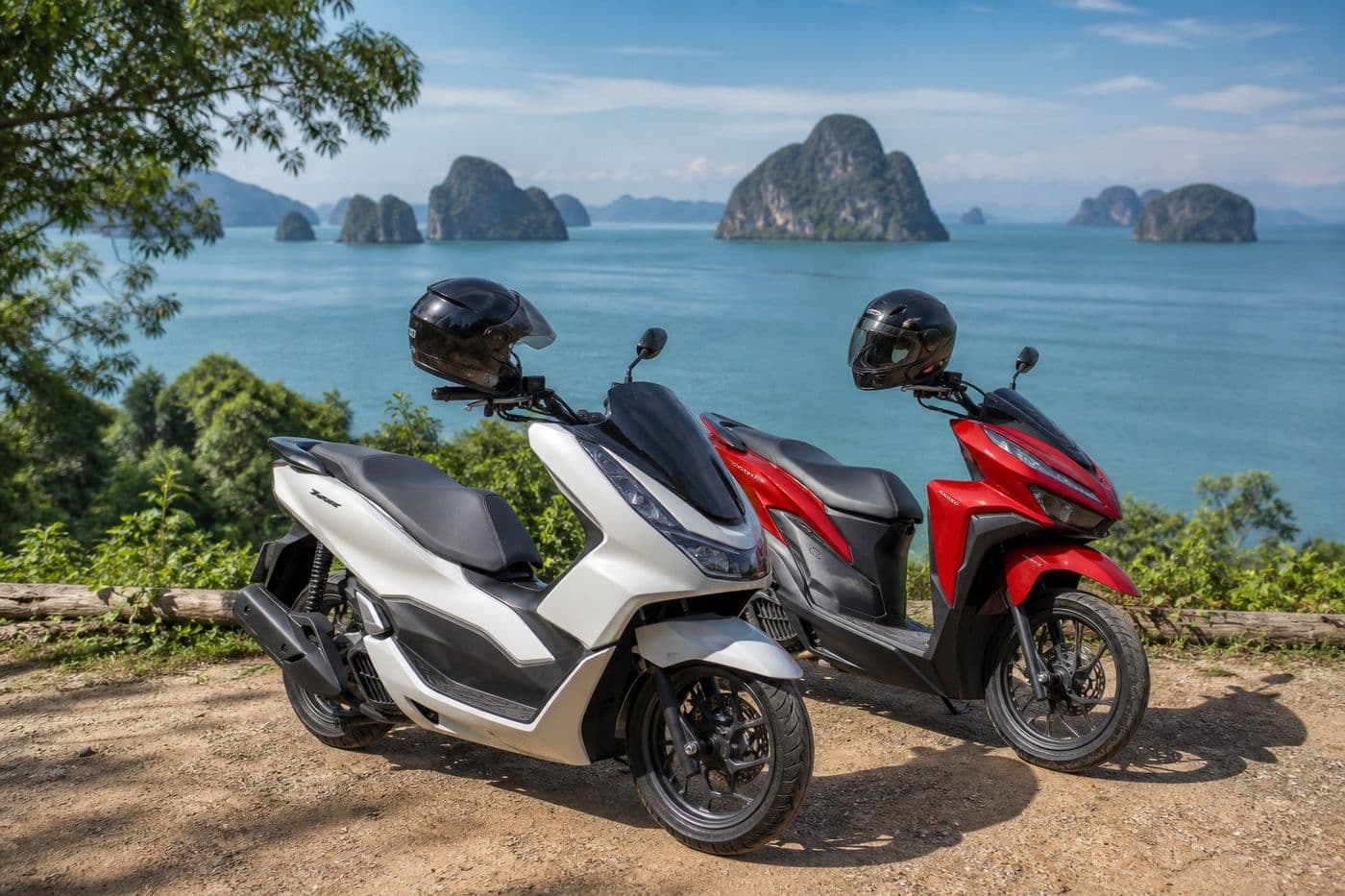 Rental scooters parked at a Krabi viewpoint with limestone islands in the background